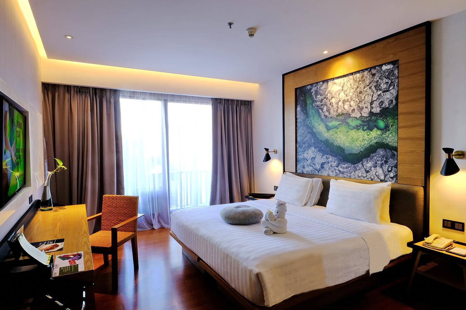Habitación Haven Premiere con balcón y vistas a la piscina