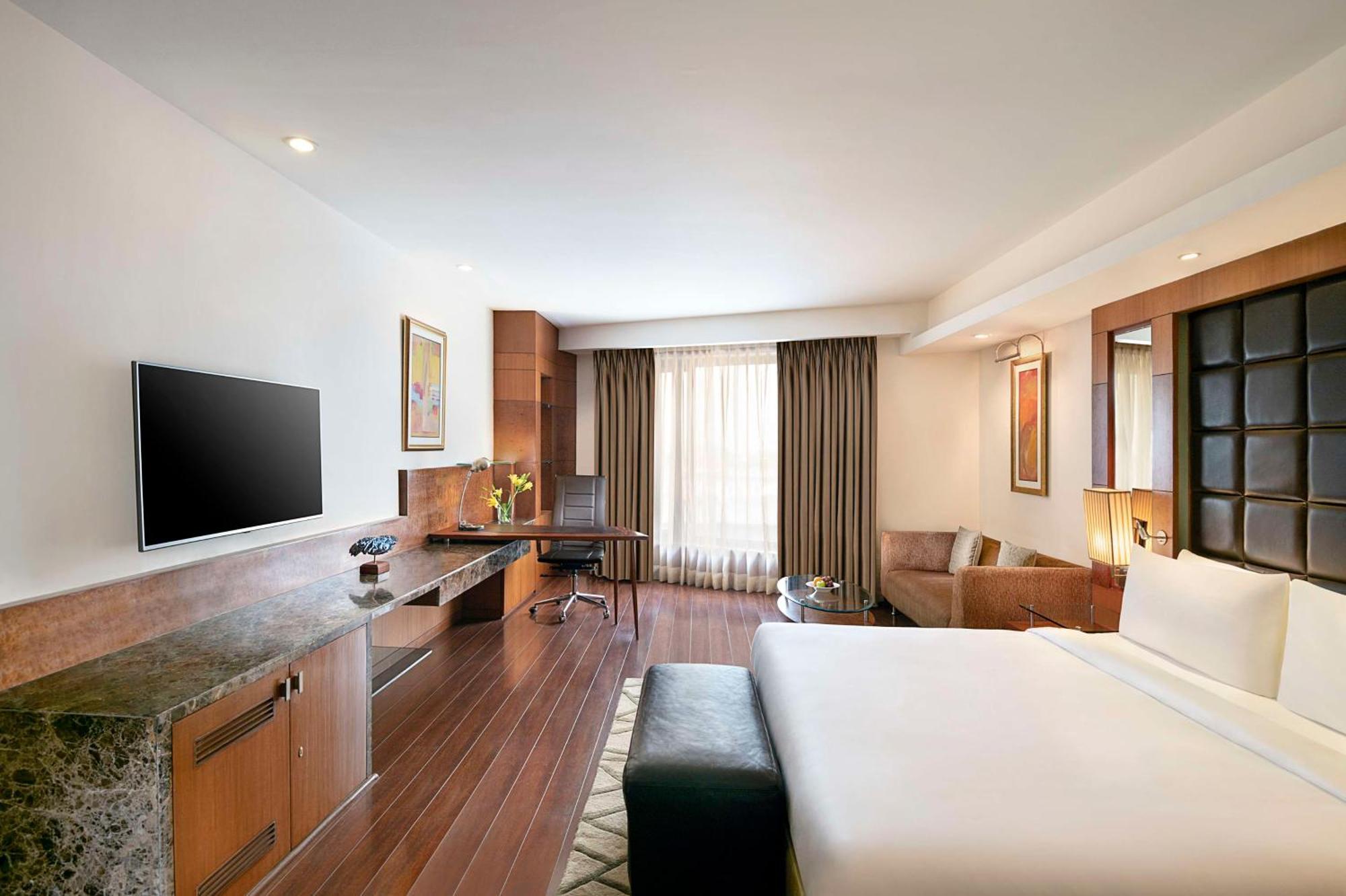 Chambre Deluxe avec Happy Hours de 13h00 à 18h00, Transfert Aéroport Aller Simple et Navette Aller-Retour Gratuite pour Worldmark Aerocity (sous réserve de disponibilité d’une voiture)