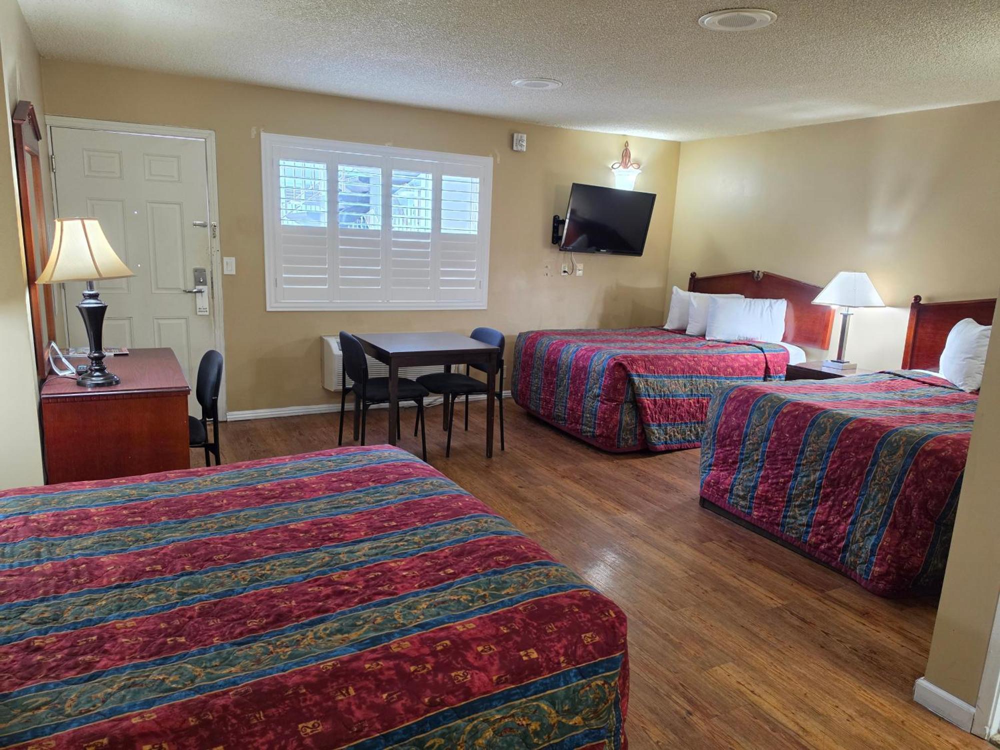 One Queen Bed and Two Full Beds