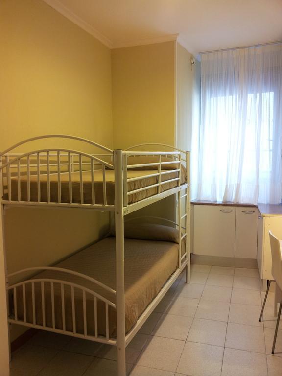 Habitación Doble con litera y baño compartido